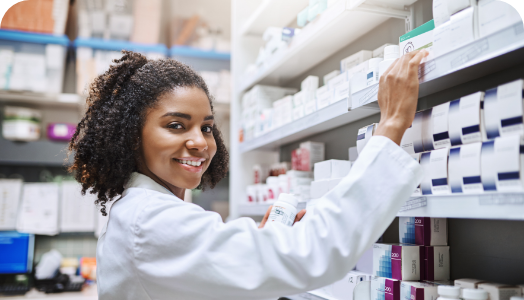 pharmacist holding to medicine rack